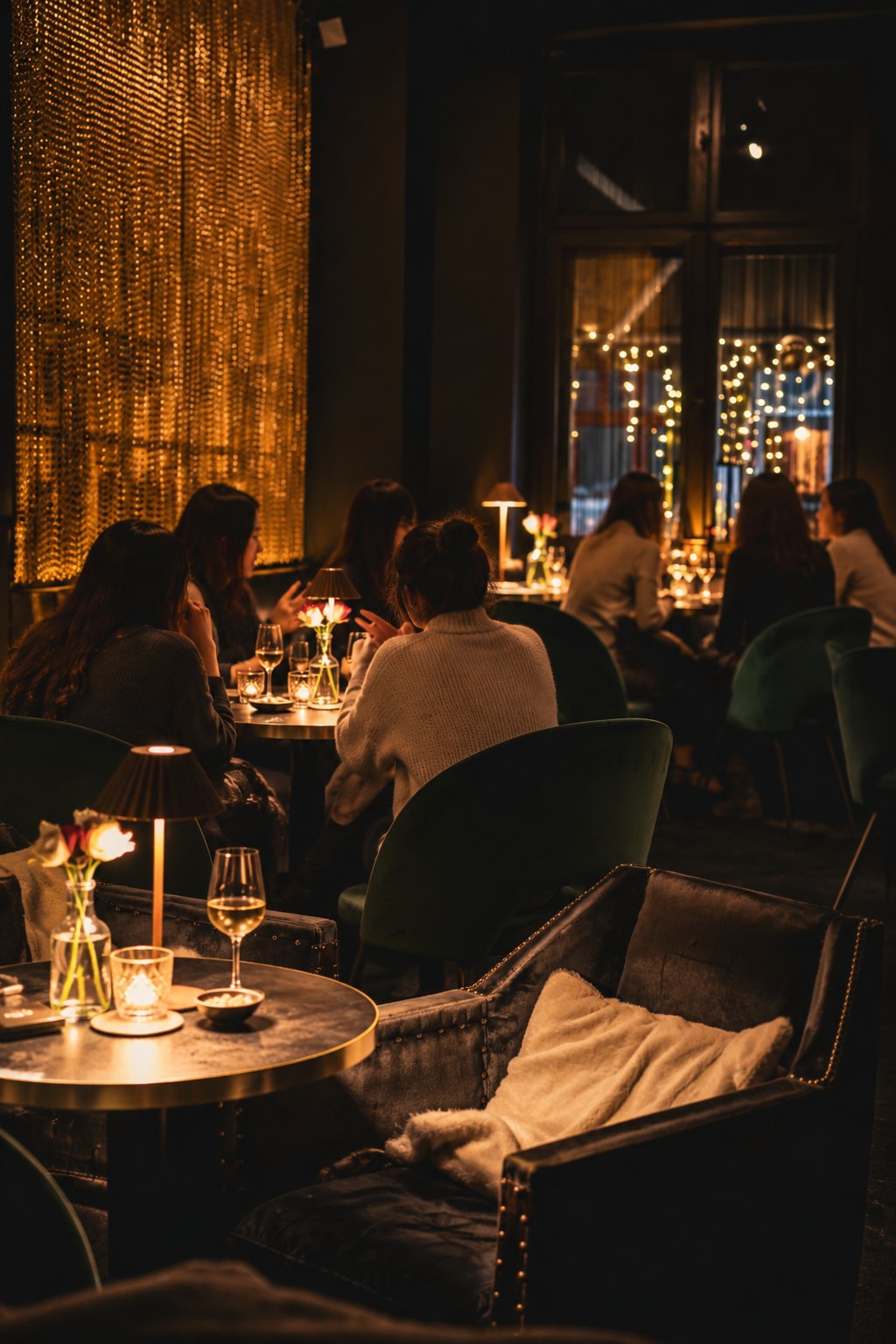 Women gathered in candlelit conversation at Beyond Small Talk