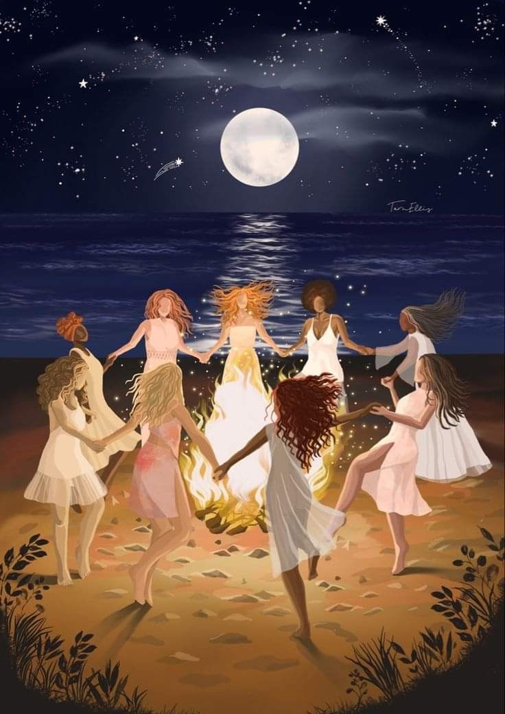 Women dancing together around a fire beneath a full moon